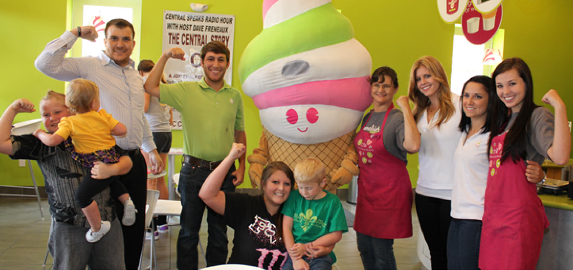 Menchie's team members posing with customers inside a store